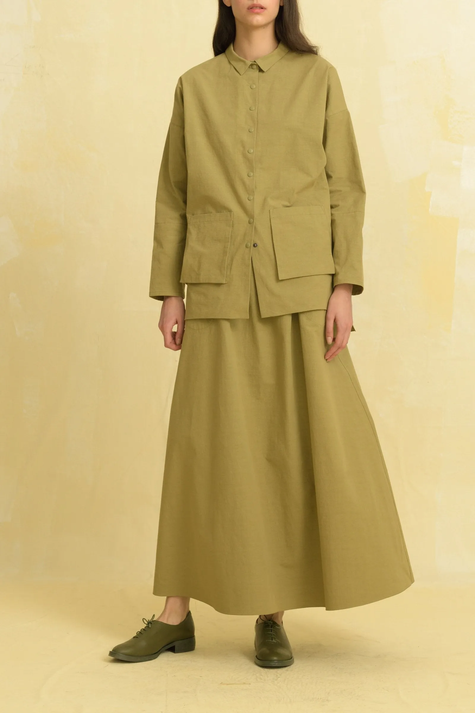 Cube, olive skirt