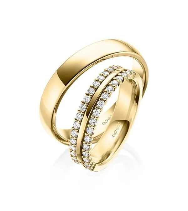 Exclusivas alianzas de boda con diamantes en oro amarillo